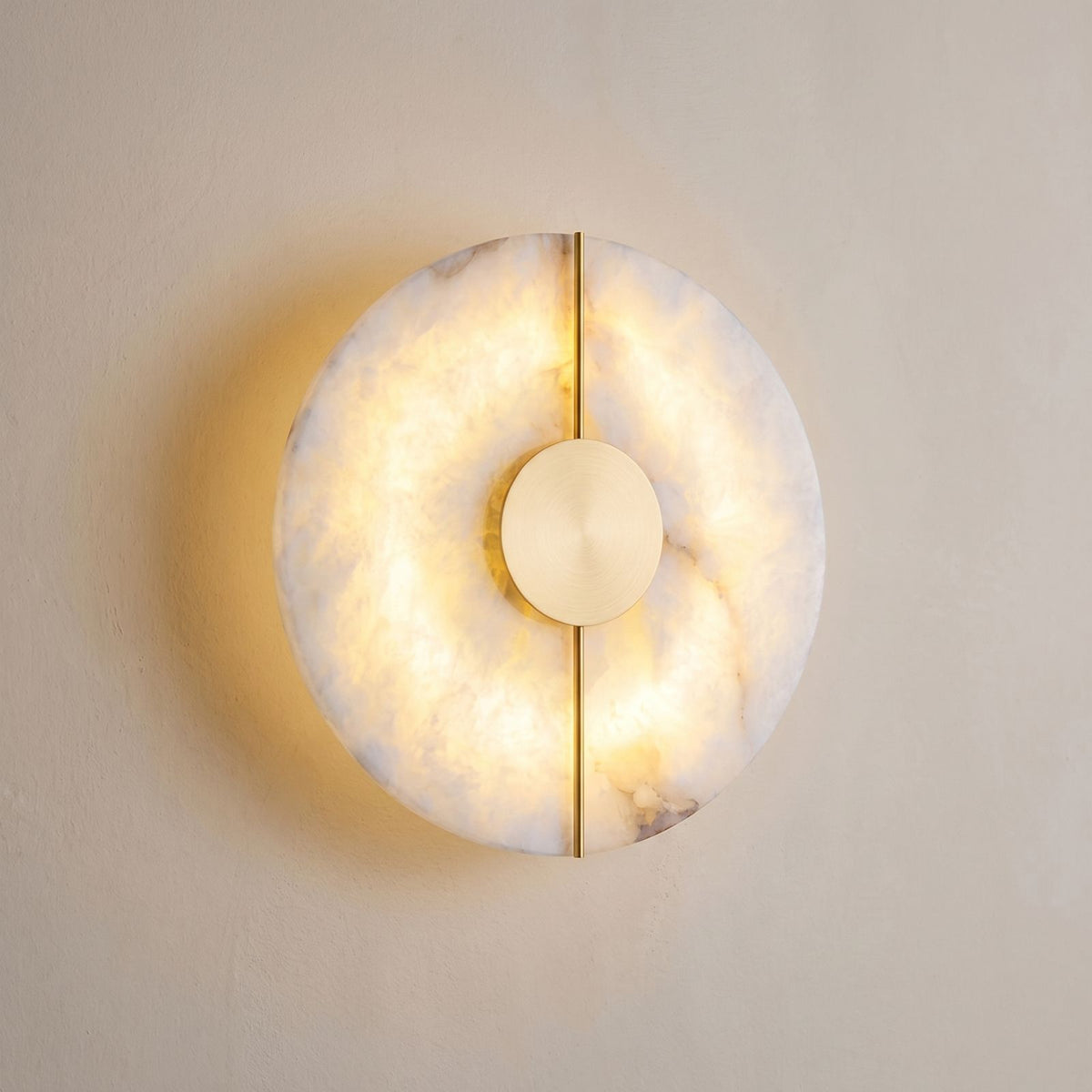 Round Split Marble Disc LED Wall Light close view of the marble disc with the gold line and centre, switched on