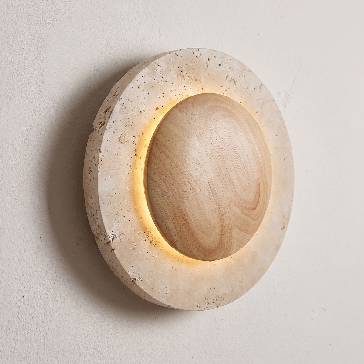 Round Travertine and Wood Shade LED Wall Light, close view at 45 degrees on a plaster wall