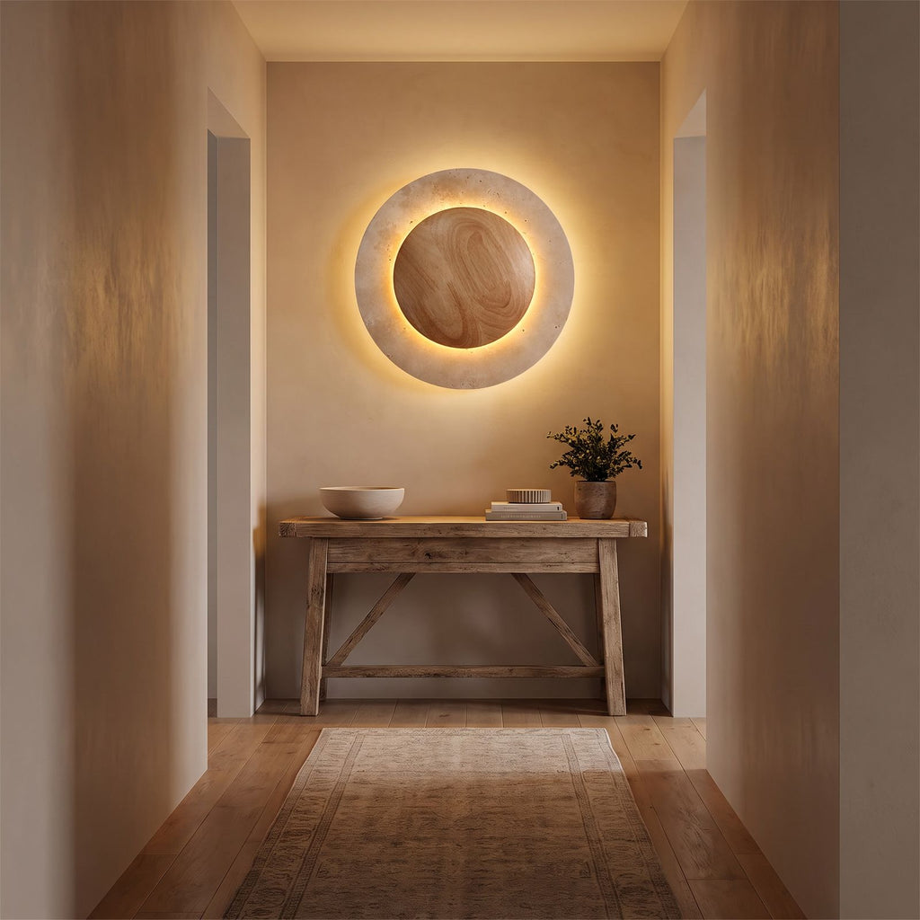 Round Travertine and Wood Shade LED Wall Light in a hallway above a timber console