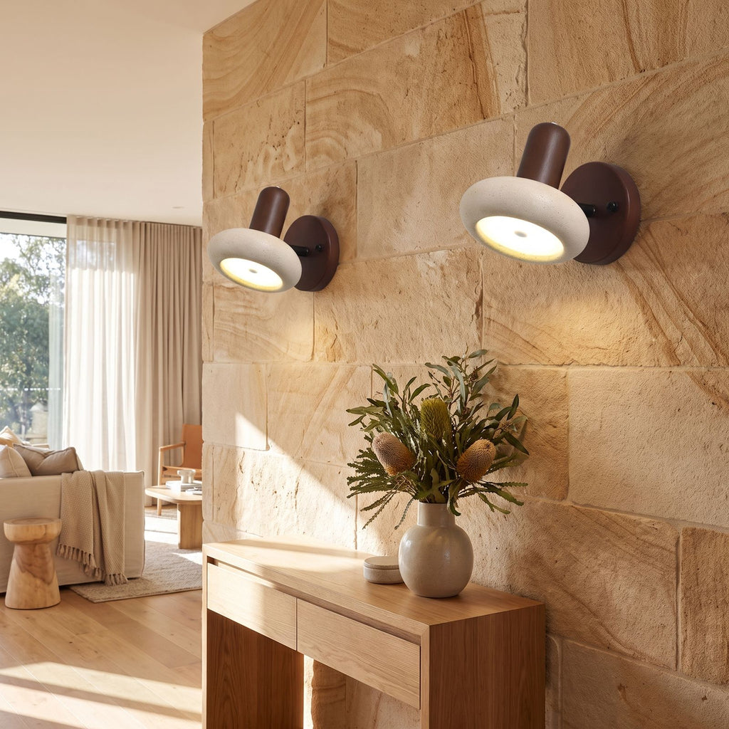 Round Travertine Swivel Bedside Wall Light in a pair on a wall of an Australian home