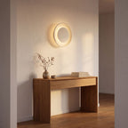 Round White Gypsum and Acrylic Wall Light in a hallway above a timber console