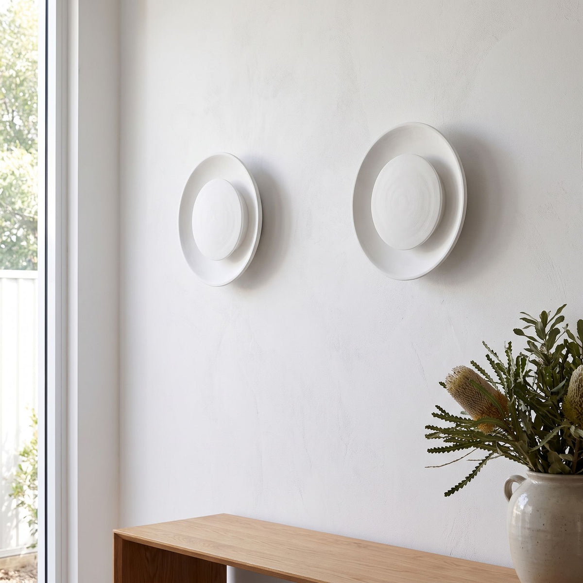 Round White Gypsum and Acrylic Wall Light in a pair on a wall of an Australian home