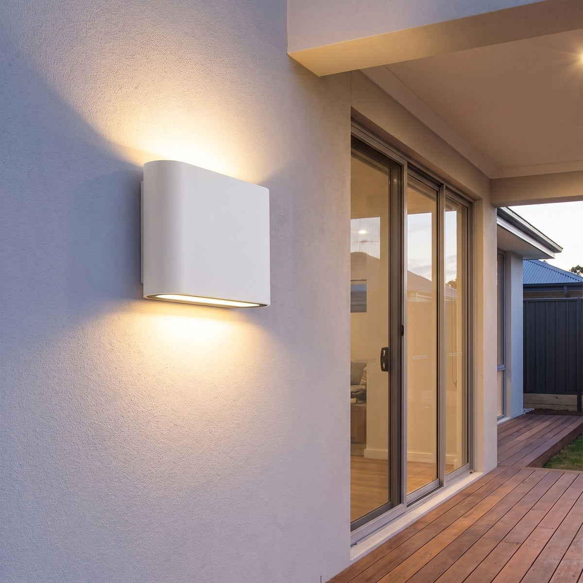 Rounded box up down outdoor wall light on a covered alfresco patio wall