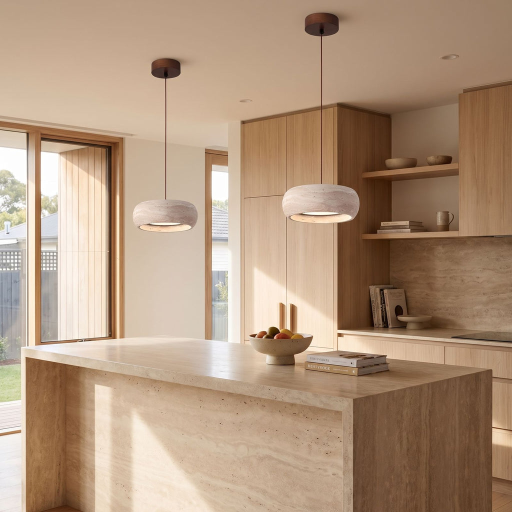 Rounded Travertine Puck LED Pendant Light in a pair over a stone kitchen island