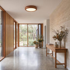 Wood grain LED oyster ceiling light on a living room ceiling