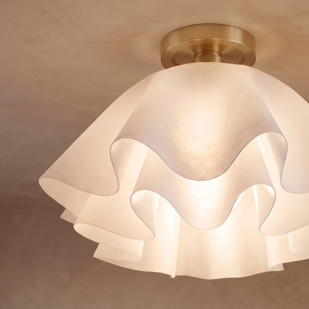 Close-up of the ruffled folds and brass canopy