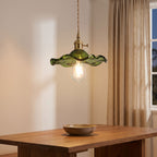 Ruffled Fluted Glass Flower Pendant Light above a dining table