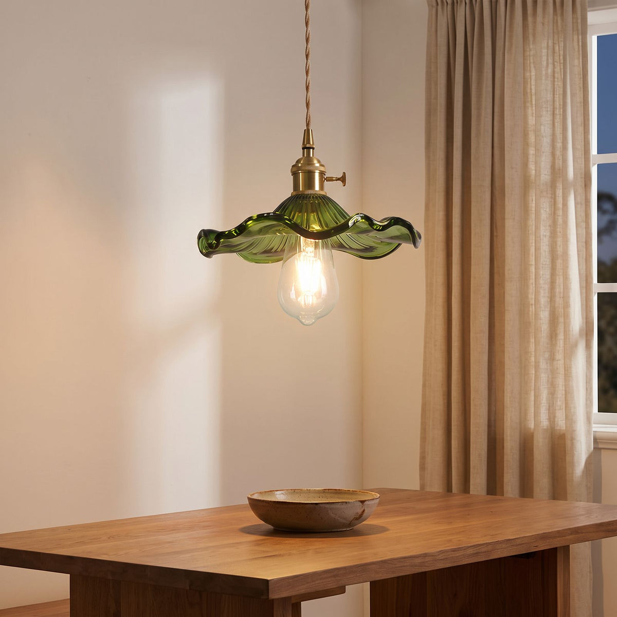 Ruffled Fluted Glass Flower Pendant Light above a dining table