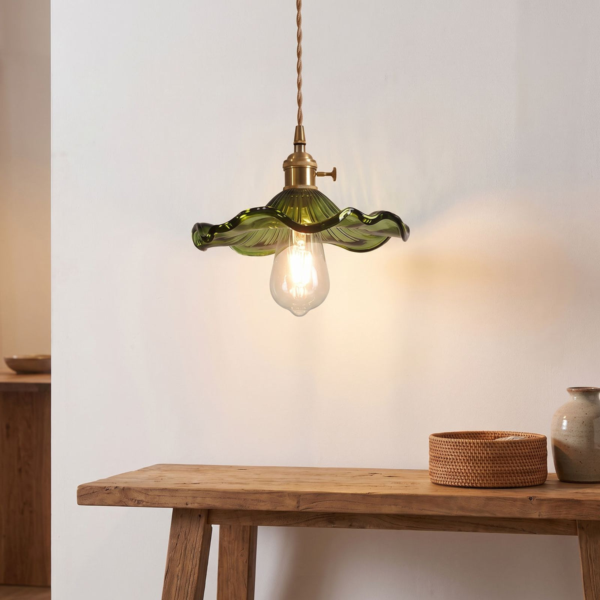 Ruffled fluted glass pendant light above an entry hall console