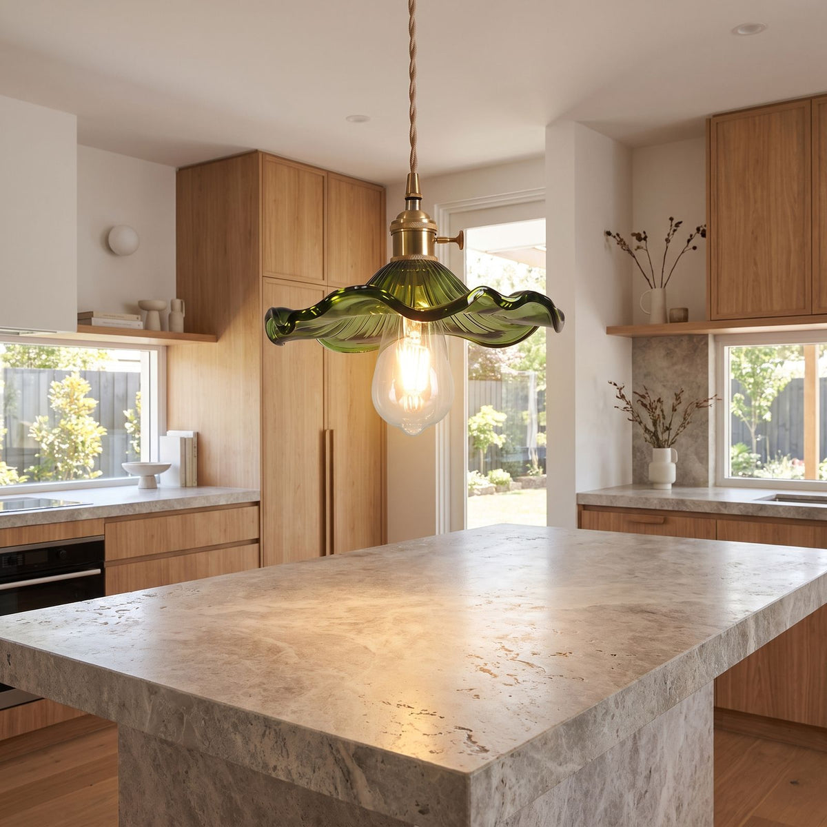 Ruffled fluted glass pendant light over a kitchen island bench
