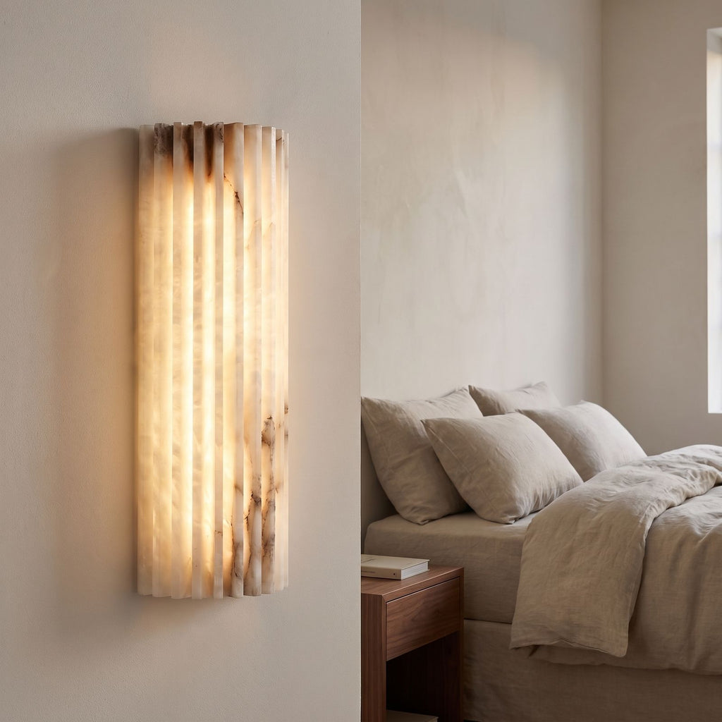 Scalloped Alabaster Half-Cylinder LED Wall Sconce beside a bed