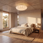 Scalloped silk shade LED ceiling light in an entry hall at night