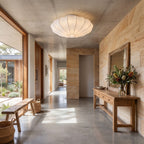 Scalloped silk shade LED ceiling light in a study in daylight