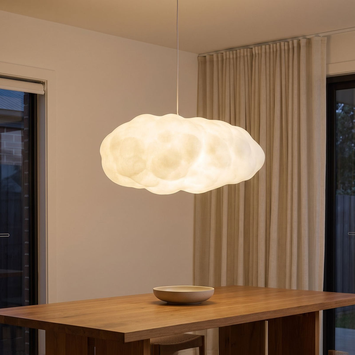 Sculpted White Cloud Pendant Light above a dining table