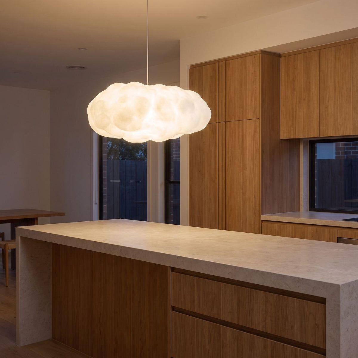 White cloud pendant light over a kitchen island bench