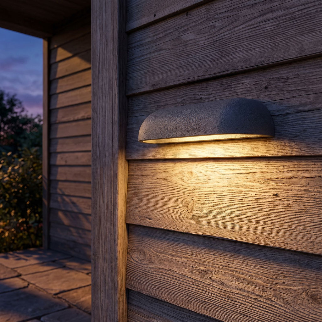 Semi Oval Stone Outdoor Wall Light on a porch wall at dusk