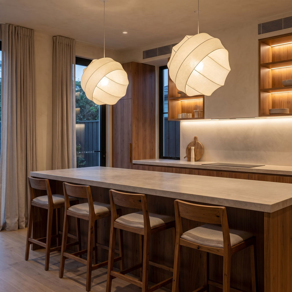 A pair of Silk Ball Japandi LED Pendant Lights over a stone kitchen island