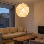Silk Ball Japandi LED Pendant Light above a linen sofa in a living room