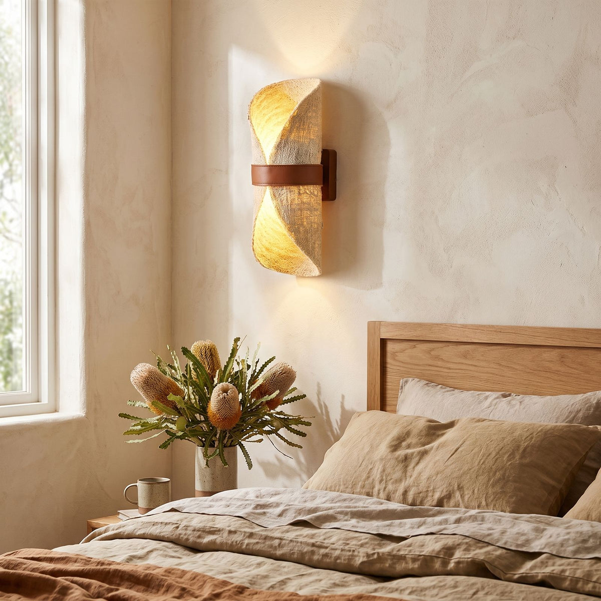 Silk Half-Cylinder Up-Down Wall Light on a bedroom wall beside the bed