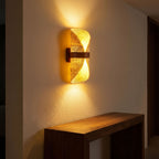 Silk Half-Cylinder Up-Down Wall Light in a hallway above a timber console