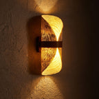 Silk Half-Cylinder Up-Down Wall Light glowing on a plaster wall at night