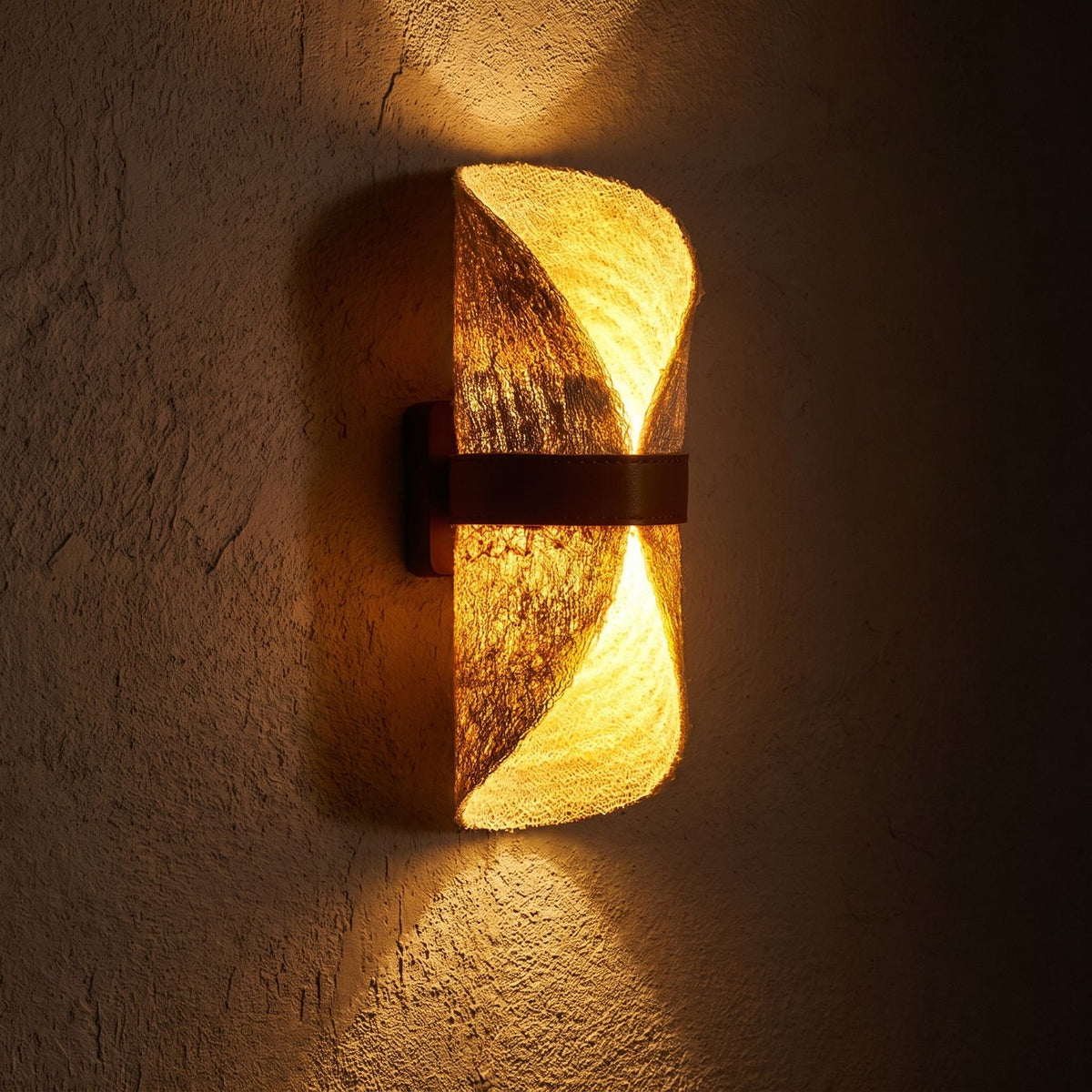Silk Half-Cylinder Up-Down Wall Light glowing on a plaster wall at night