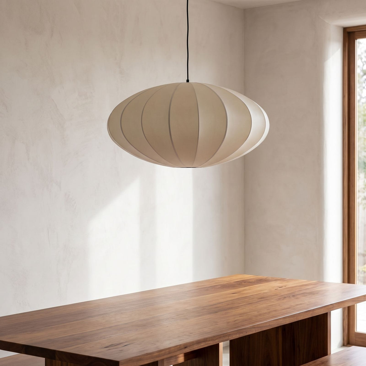 Silk Pumpkin Lantern Japandi Pendant Light above a timber dining table