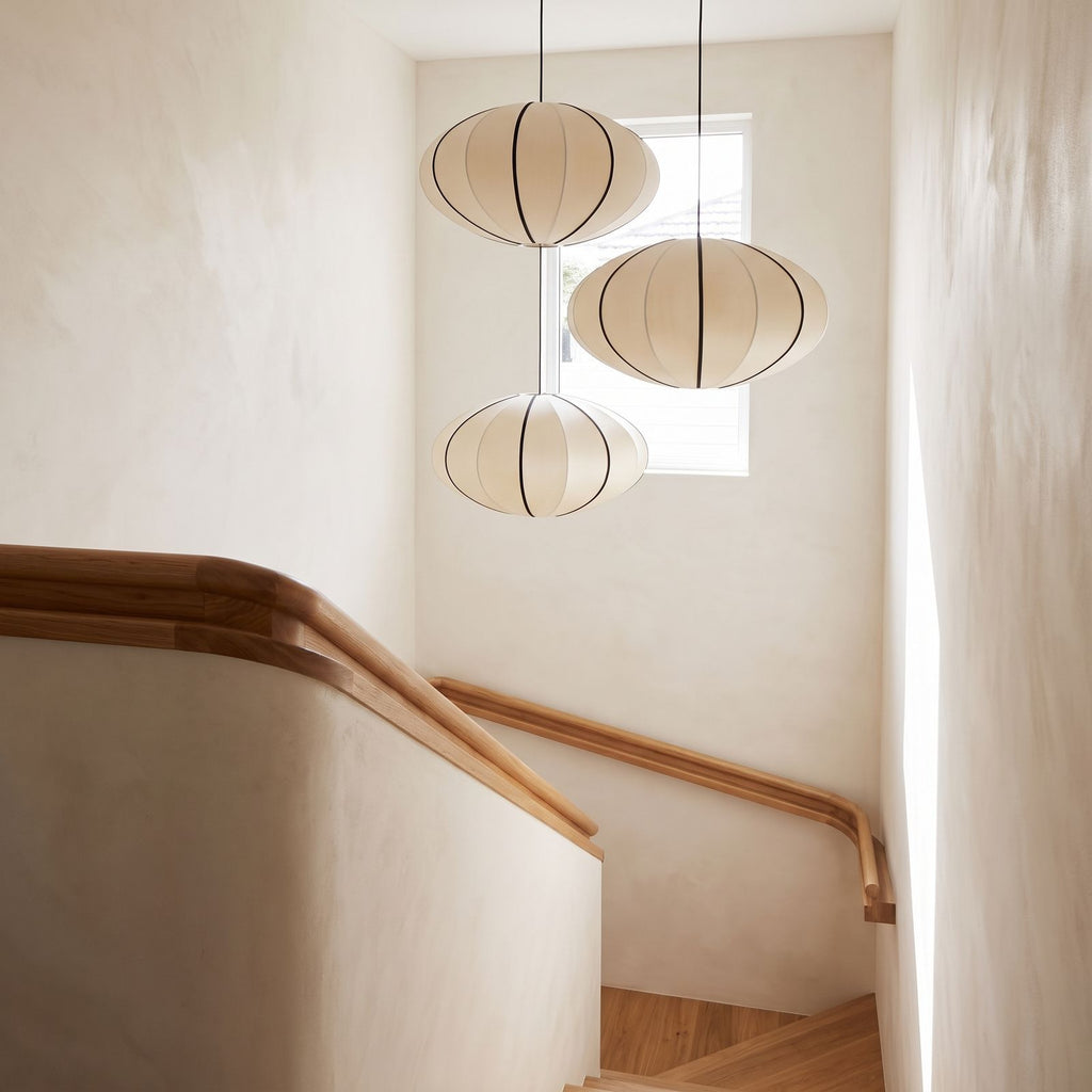 Silk Pumpkin Lantern Japandi Pendant Light in a group of three in a stairwell