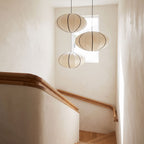Silk Pumpkin Lantern Japandi Pendant Light in a group of three in a stairwell