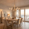 Six Arm Distressed Candle Chandelier above a dining table at golden hour