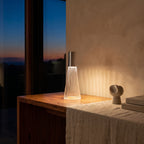 Slim Acrylic Rechargeable Touch Table Lamp glowing on a timber console at dusk