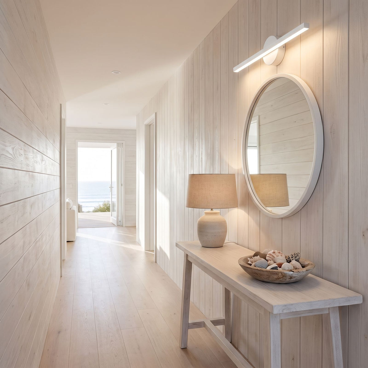 Slim Aluminium Disc and Bar LED Vanity Wall Light above a mirror in a hallway