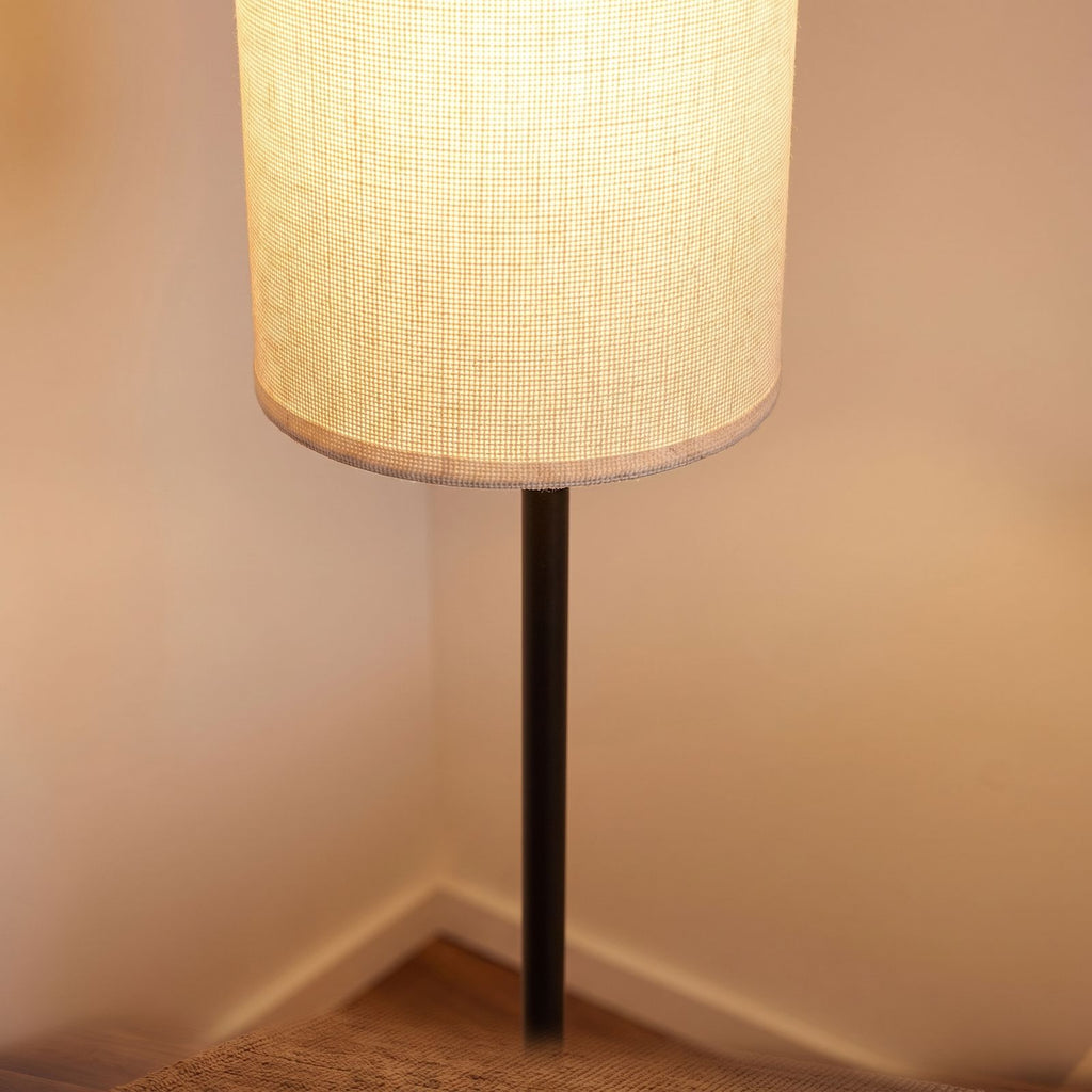 Close-up of the woven fabric cylinder shade on the black pole