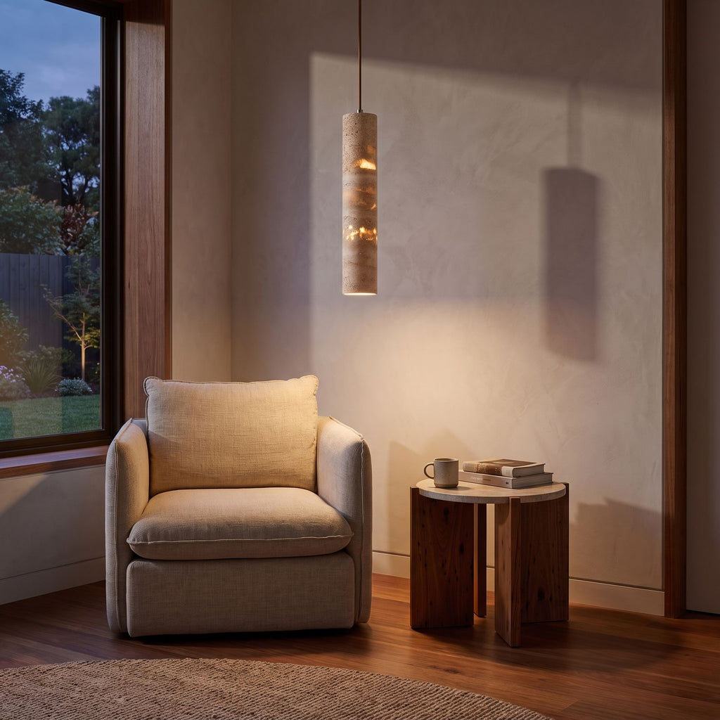 Slim Cream Marble Tube LED Pendant Light above an armchair in a reading corner