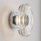 Slim Crystal Disc LED Wall Light, close view at 45 degrees on a plaster wall