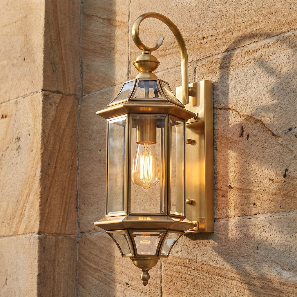 Slim Cylinder Brass Glass Outdoor Wall Light, close view at 45 degrees on a stone wall