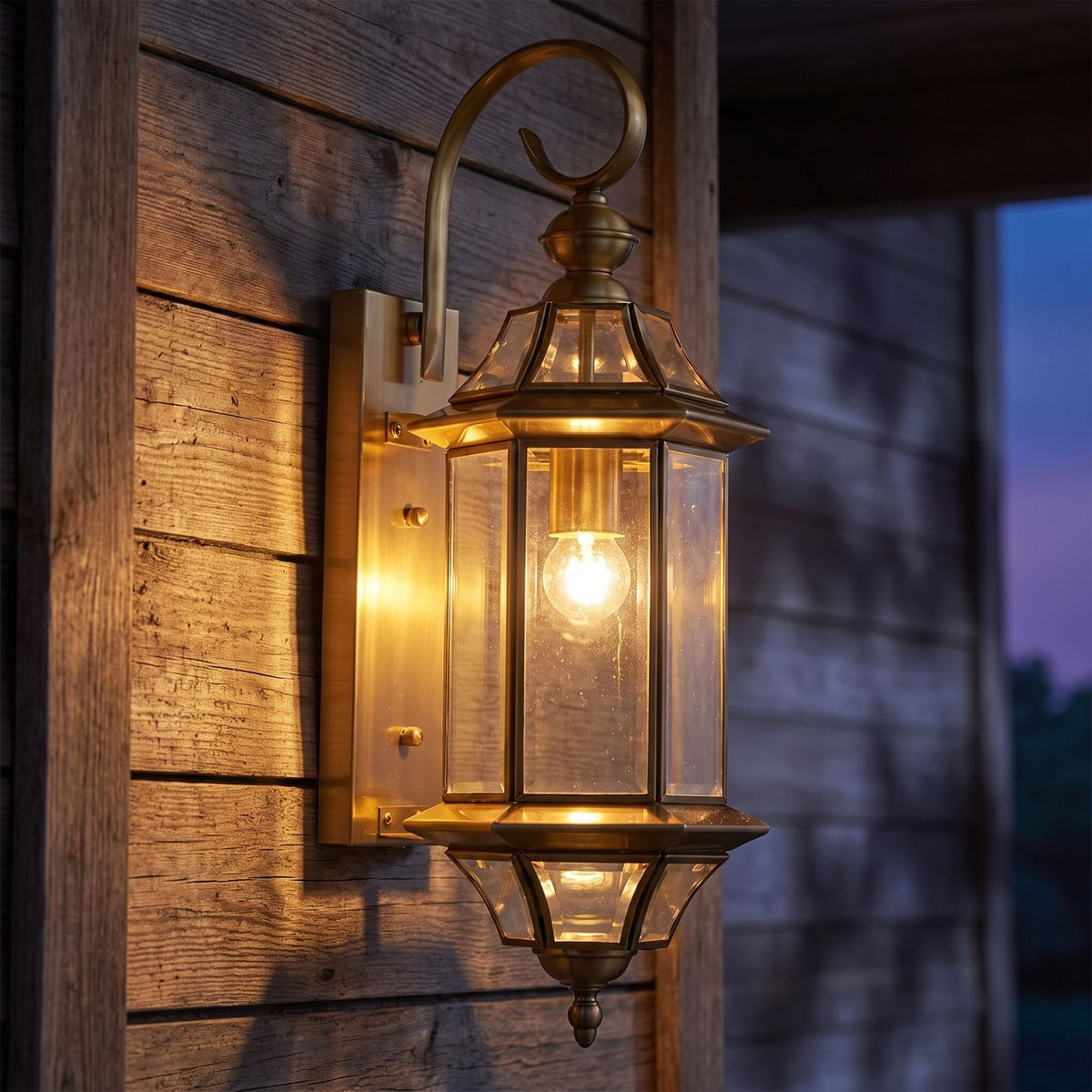 Slim Cylinder Brass Glass Outdoor Wall Light on a porch wall at dusk