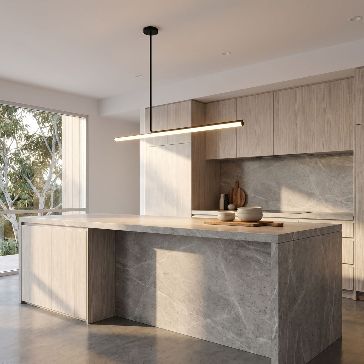 Slim Linear LED Aluminium Pendant Light above a stone kitchen island