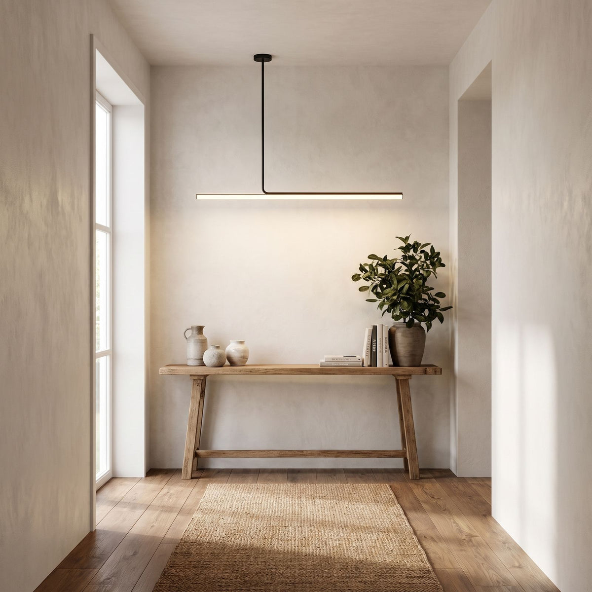Slim Linear LED Aluminium Pendant Light above a console in an entry hallway