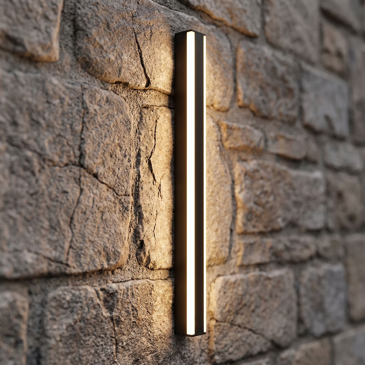 Slim Linear Metal Outdoor Wall Light, close view at 45 degrees on a stone wall
