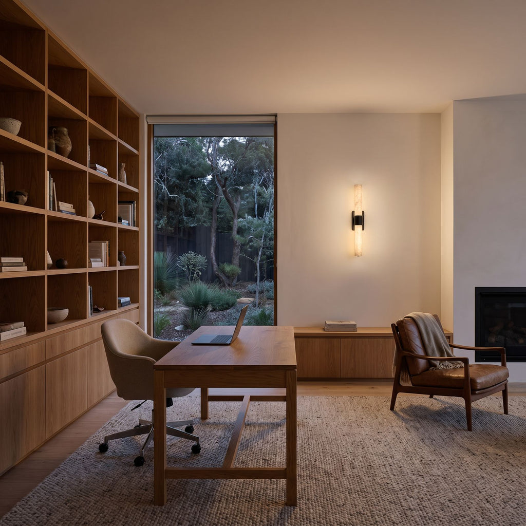 The marble tube wall light with a black bracket in a home office, above the cabinet by the desk