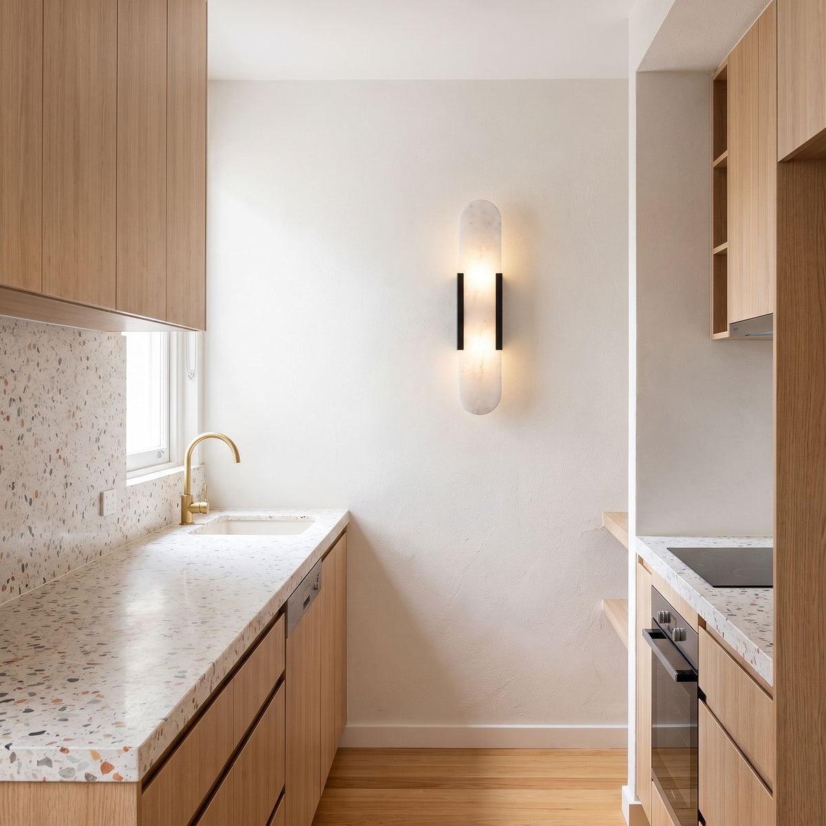 Slim Natural Marble Column Up Down Wall Light on a kitchen wall