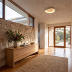 Slim teardrop LED ceiling light on an entry hall ceiling in daylight