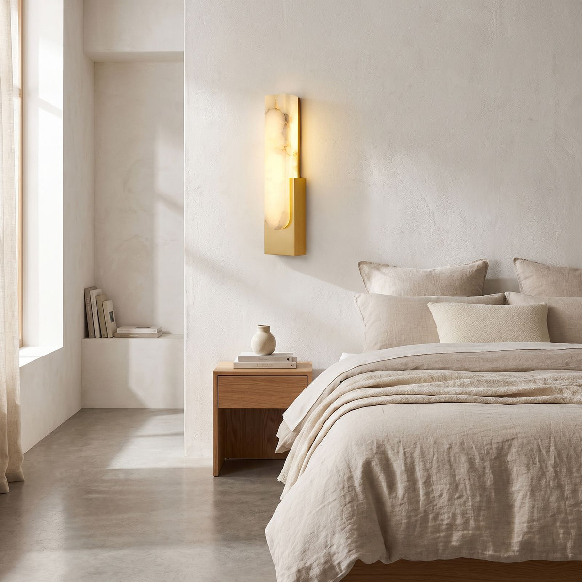 Slim Vertical Alabaster LED Wall Light on a bedroom wall beside the bed