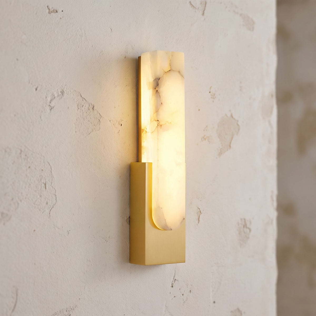 Slim Vertical Alabaster LED Wall Light, close view at 45 degrees on a plaster wall