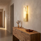Slim Vertical Alabaster LED Wall Light in a hallway above a timber console