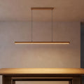 Slim Wood Bar Linear LED Pendant Light above a dining table