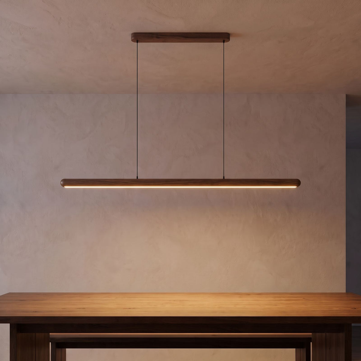 Slim Wood Bar Linear LED Pendant Light in walnut above a dining table