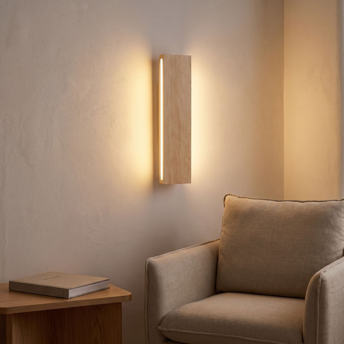 Slim wood plank wall sconce above an armchair in a reading corner