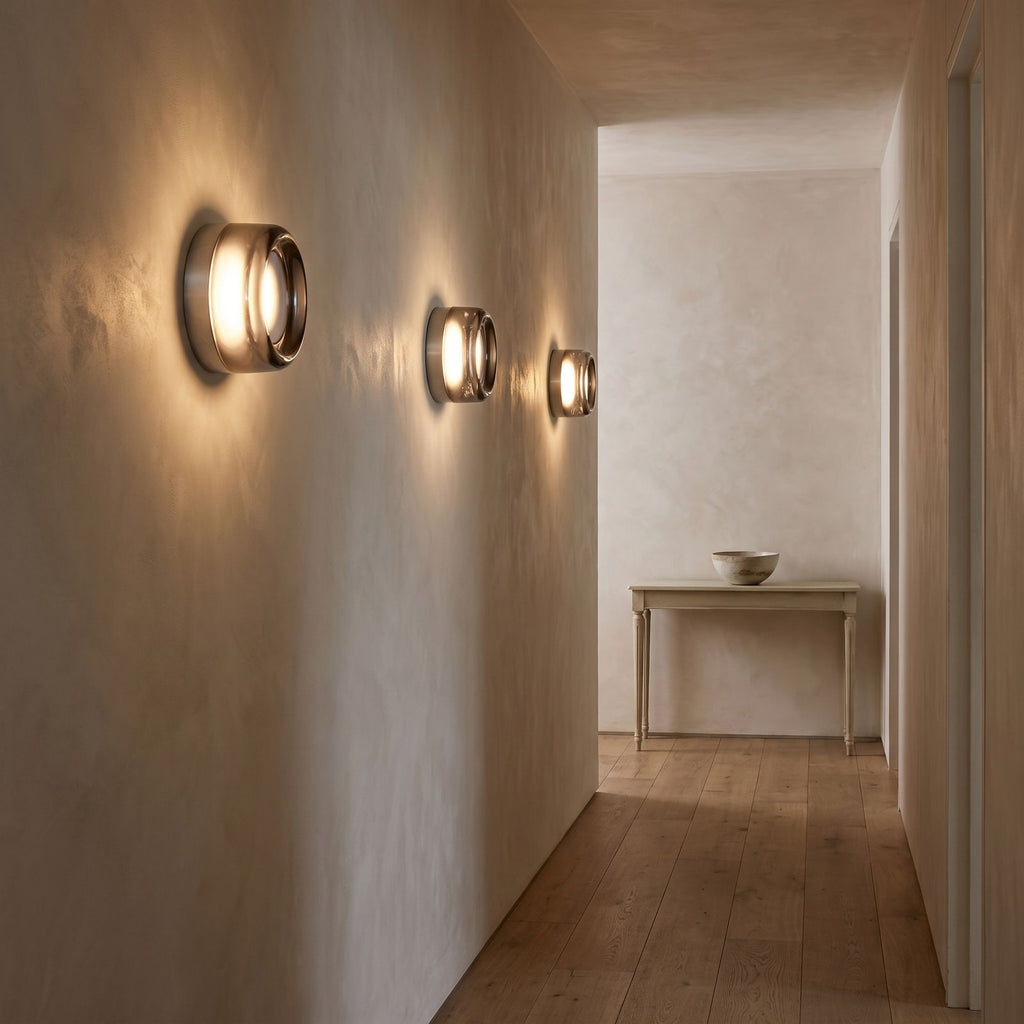 Three Smoked Dimple Glass LED Wall Lights along a hallway